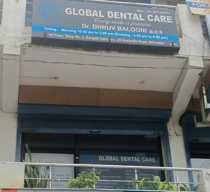 Global Dental Care signboard above the clinic on Neshvilla Road, Dehradun