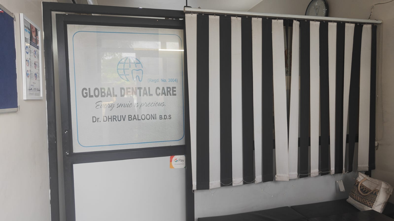 Entrance to Global Dental Care with the etched logo on the door